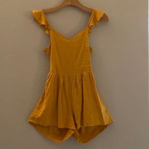 Summery romper with open back. New without tags